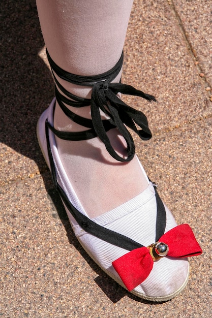 Photo low section of woman wearing shoe during sardana dance