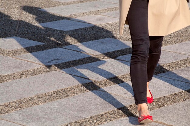 Low-section of woman on zebra crossing