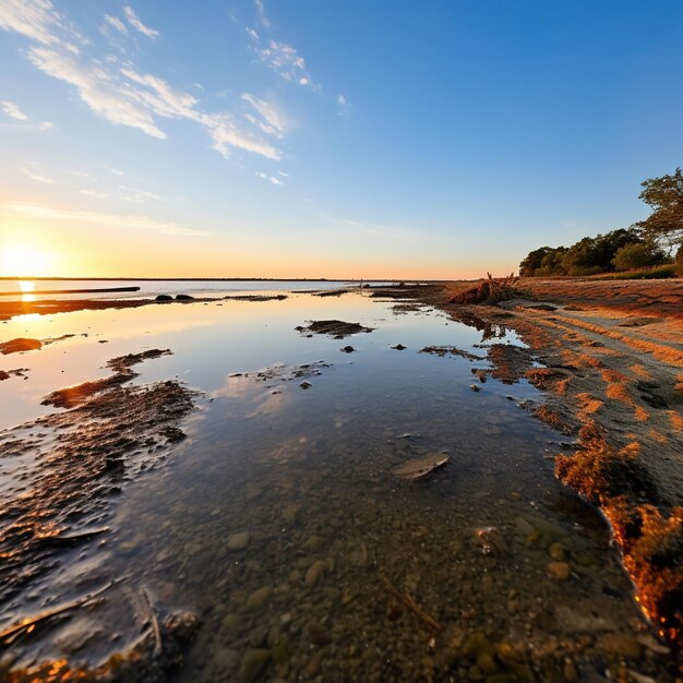 Low tide on a beach at sunset