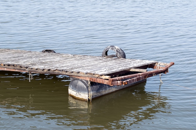 low tide on the lake and a wooden dock