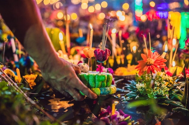 Loy Krathong festival People buy flowers and candle to light and float on water to celebrate the Loy Krathong festival in Thailand