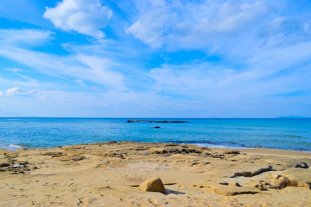 Lu Bagnu rocky shore on a cloudy day Sardinia