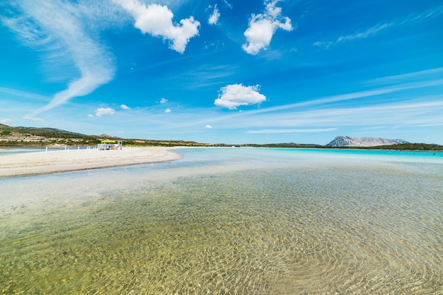 Lu Impostu beach under clouds Sardinia