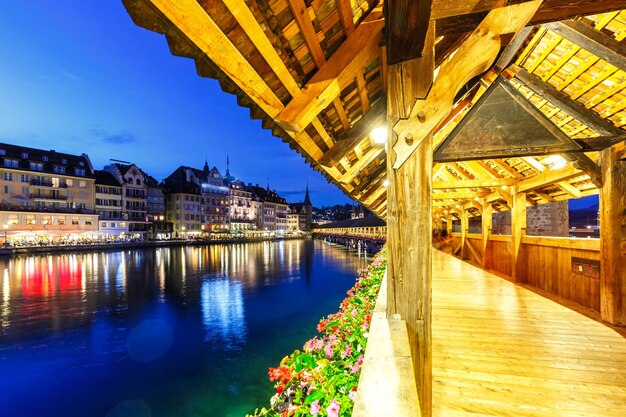 Lucerne Chapel Bridge Kapellbrucke city at Reuss river at twilight traveling in Switzerland