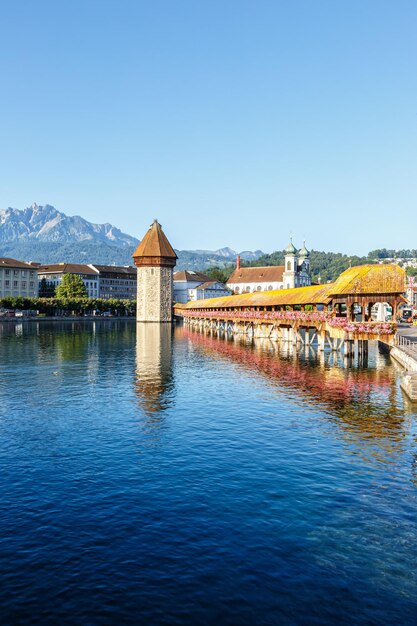 Lucerne city at Reuss river with Kapellbrucke and Pilatus mountain portrait format traveling in Switzerland