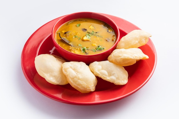 Luchi Cholar Dal or Fried bread made of flour served along with curried Chana or Bengal gram