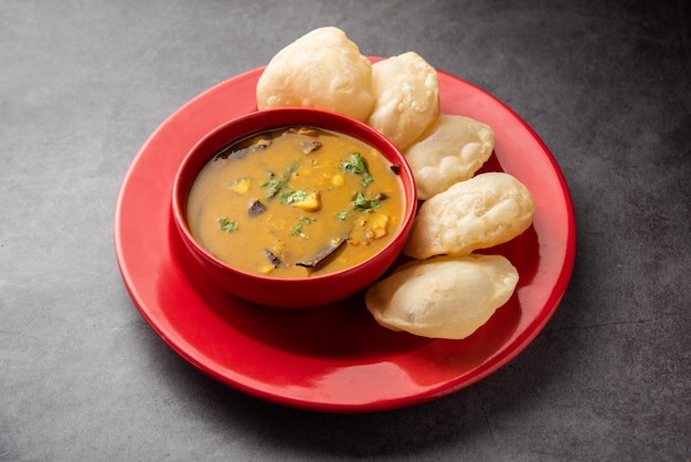 Luchi Cholar Dal or Fried bread made of flour served along with curried Chana or Bengal gram