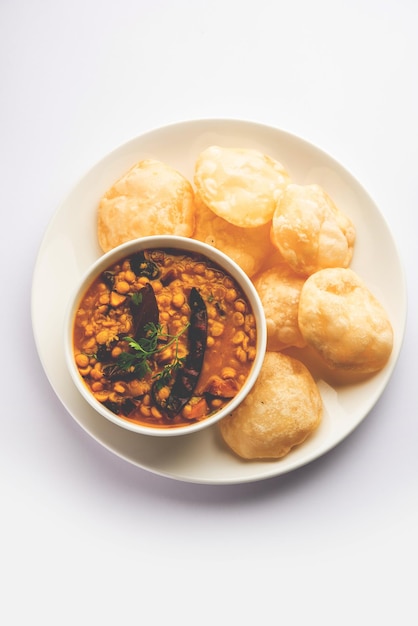 Luchi Cholar Dal or Fried bread made of flour served along with curried Chana or Bengal gram