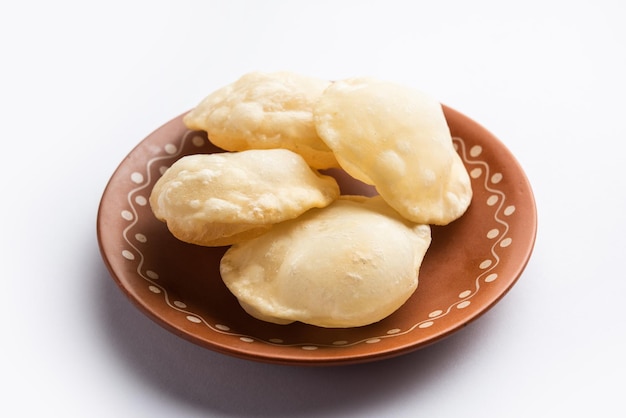 Luchi or Lusi is a deepfried poori or flatbread made of Maida flour originating from Bengal