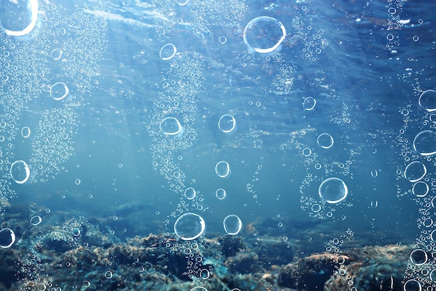 Foto luchtbellen onderwater blauwe achtergrond, oceaan diepte duiken