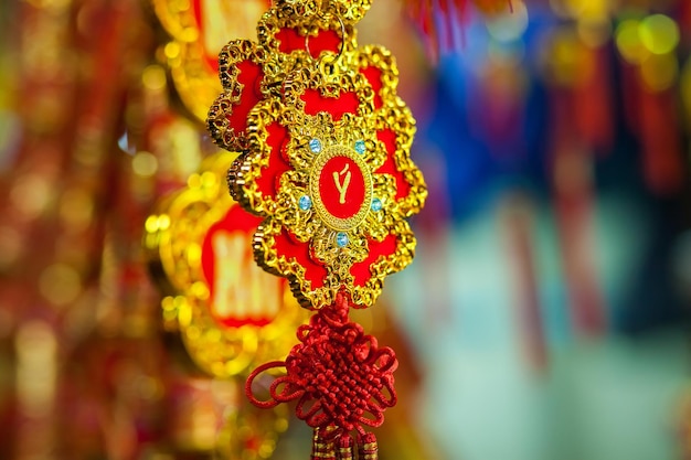 Lucky knot lunar new year decoration in Vietnam with gold and red colours. Asian new year. Chinese lunar new year background.