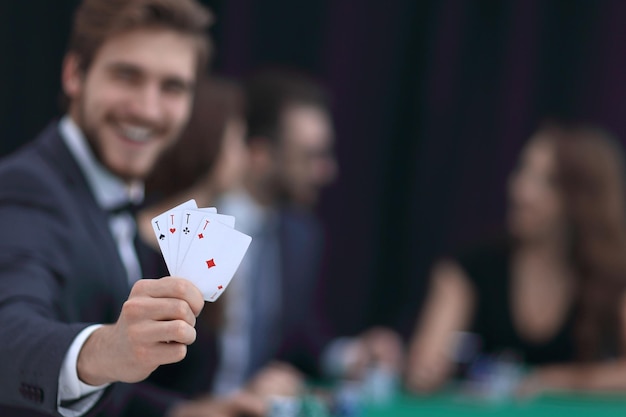 Lucky player with the winning combination of cards in casino