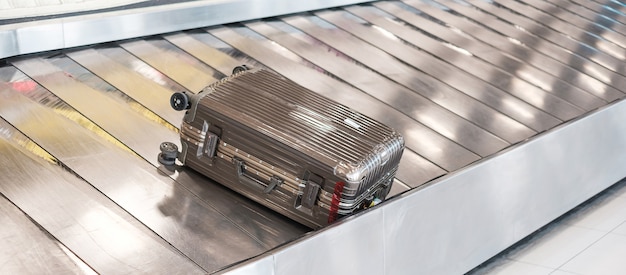 luggage bag on conveyor belt in the airport