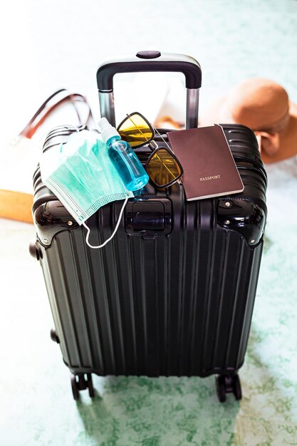 Luggage and travelSuitcase passport and medical maskFlights canceled or delayed transportation