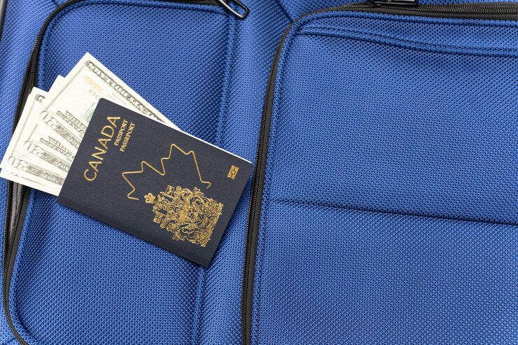 Photo luggage with passport and united states dollar banknotes