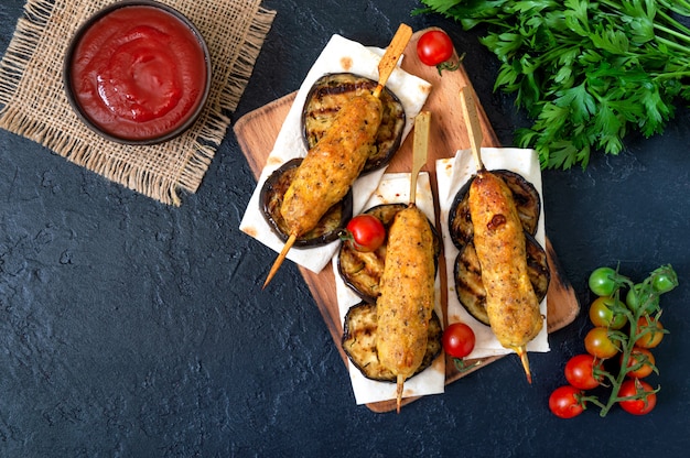 Lula kebab with grilled eggplant on pita bread