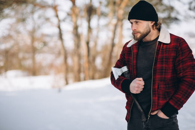 Lumberjack with ax in the woods