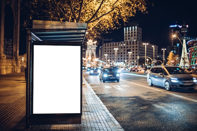 Luminous advertising lightbox at a bus stop