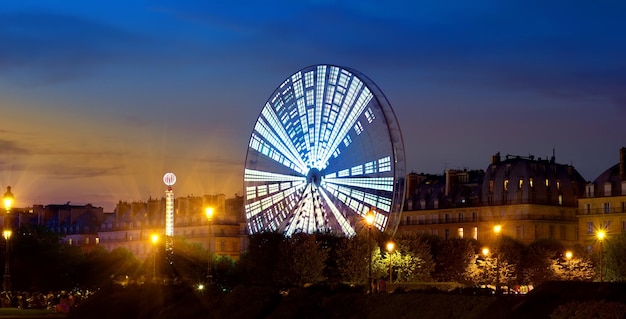 Luminous Ferris Wheel in the evening Paris, France