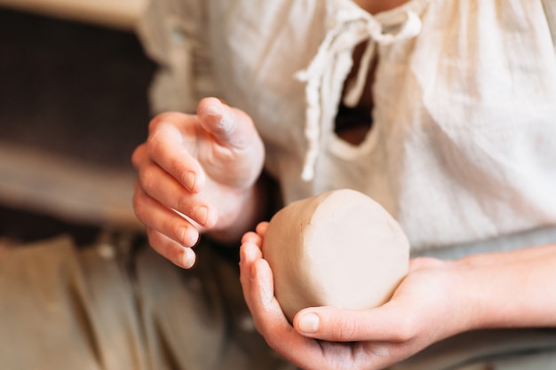 Lump of clay in potter hands