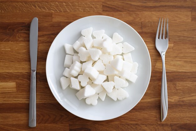 Lump sugar lying on plate