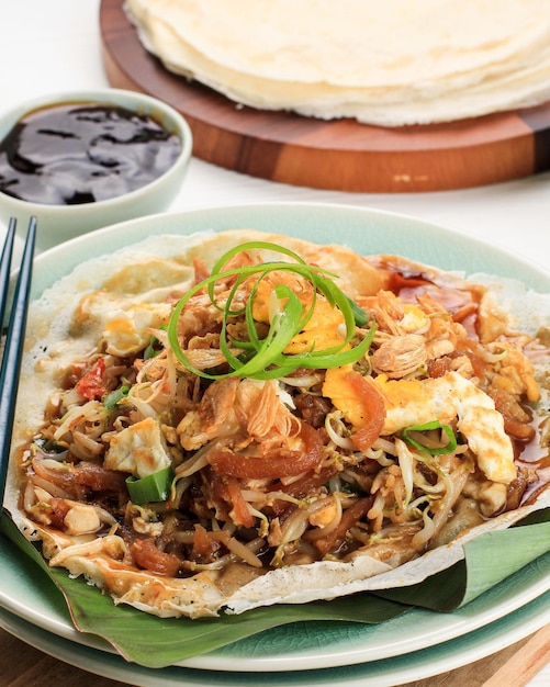 Lumpia Basah Bandung, Popular Traditional Street Food Snack Made from Thin Wrapper with Saute Spicy Soy Bean Sprout and Bamboo Sprout, add with Sticky Sweet Paste from Starch