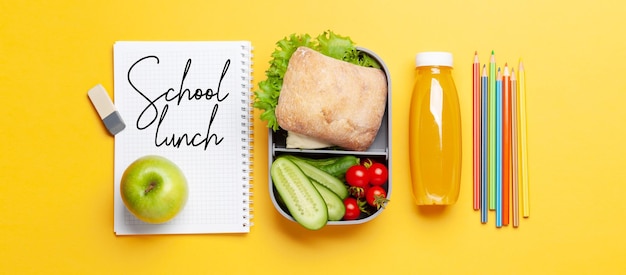 Lunch box with sandwich vegetables and juice