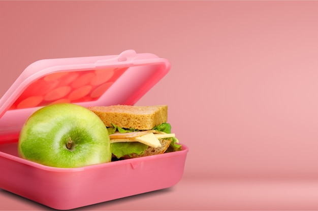 Lunchbox with an apple and sandwich