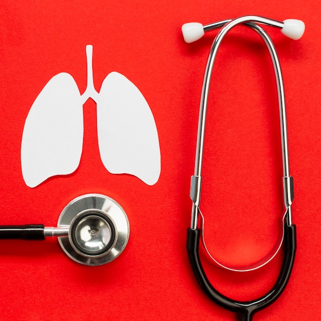 Lungs paper shape with stethoscope on desk