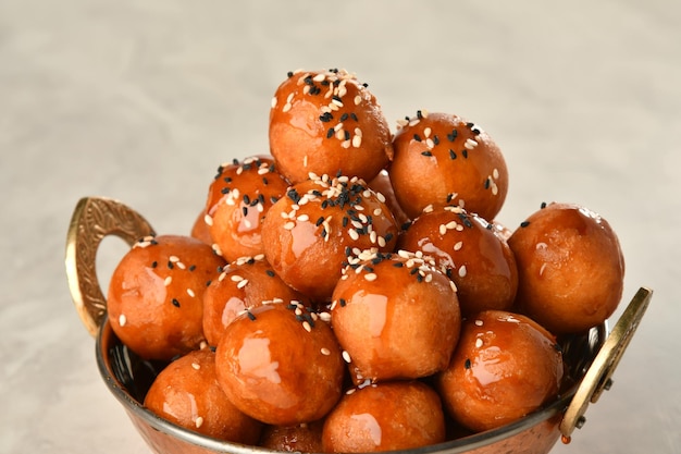 luqaimat or lokma. freshly fried lokma piled high a popular middle eastern dessert