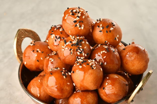 luqaimat or lokma. freshly fried lokma piled high a popular middle eastern dessert