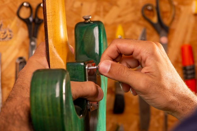 Luthier repairing a guitar