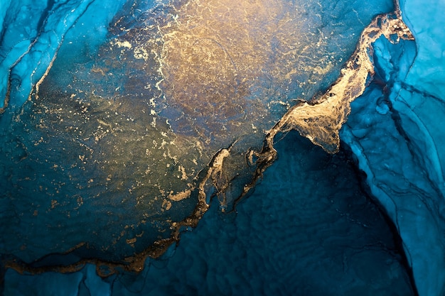Luxe abstracte achtergrond in alcohol inkt techniek, indigo blauw goud vloeibare schilderij, verspreide acryl blobs en wervelende vlekken, gedrukte materialen