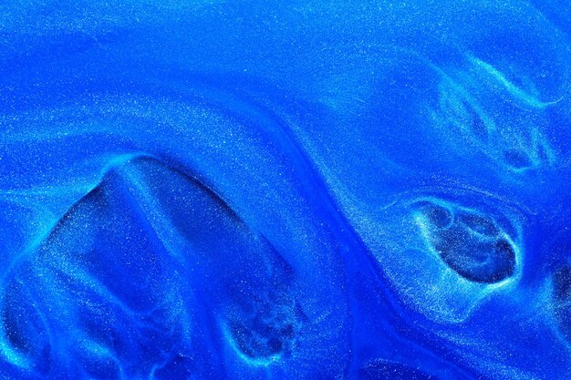 Luxe abstracte achtergrond vloeibare kunst Blauwe alcohol inkt met gouden verf strepen wateroppervlak marmeren textuur