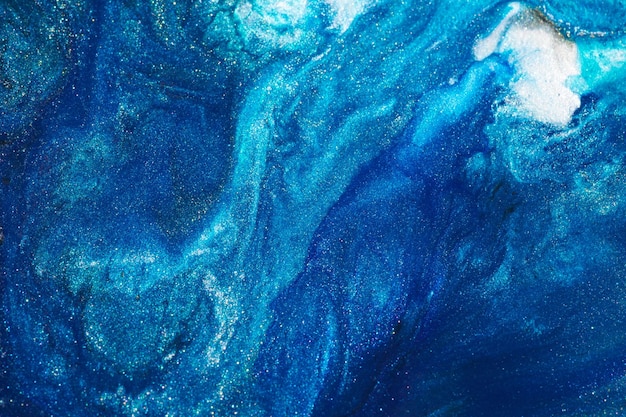 Luxe abstracte achtergrond vloeibare kunst Blauwe alcohol inkt met gouden verf strepen wateroppervlak marmeren textuur