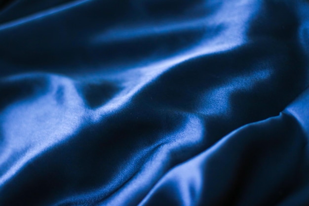 Luxe donkerblauwe zachte zijde flatlay achtergrond textuur vakantie glamour abstracte backdrop