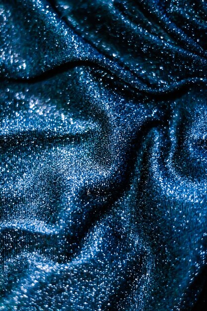 Luxe glowing texture night club branding and new years party concept  blue holiday sparkling glitter abstract background luxury shiny fabric material for glamour design and festive invitation