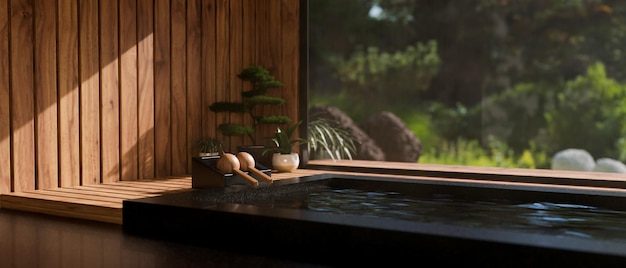 Luxe mooie Japanse Onsen of jacuzzi tegen de grote glazen ruit met prachtig uitzicht op de natuur