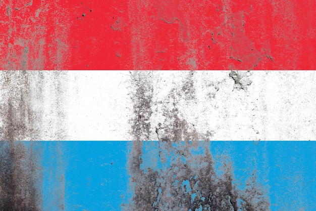 Luxembourg flag painted on a grungy old concrete wall surface