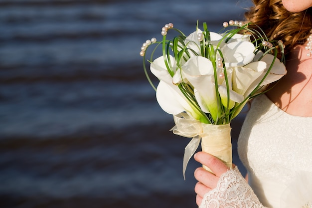 Luxurious bouquet in brides hand