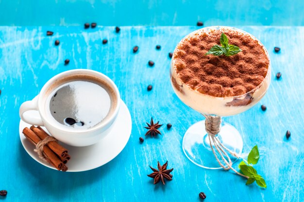 Luxurious dessert Tiramisu in a glass decorated with mint