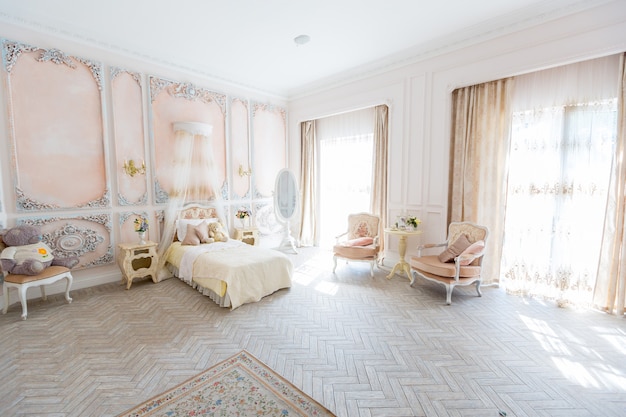 Luxurious expensive interior design room in the old Baroque style in beige colors