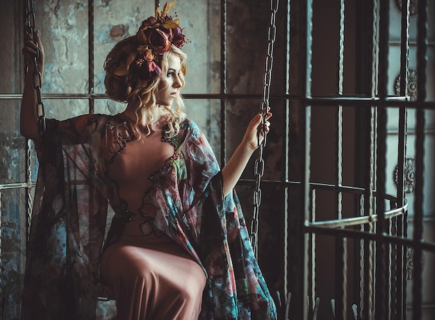 Luxurious fashion stylish girl in cage Flower dress and a wr