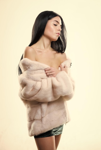 Luxurious fur female with makeup wear mink beige fur coat girl posing fur coat woman attractive nude shoulders wear short coat fashion concept girl elegant lady wear fashionable coat jacket