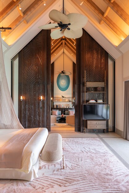 Luxurious interior of a very expensive rich water villa in the Maldives, decorated with natural wood.