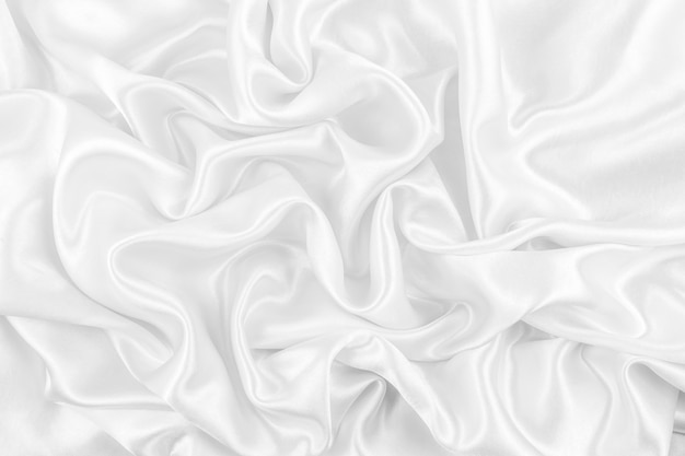 Luxurious of smooth white silk or satin fabric texture background