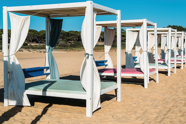 Luxurious sunloungers on the beach at quarteira algarve portugal