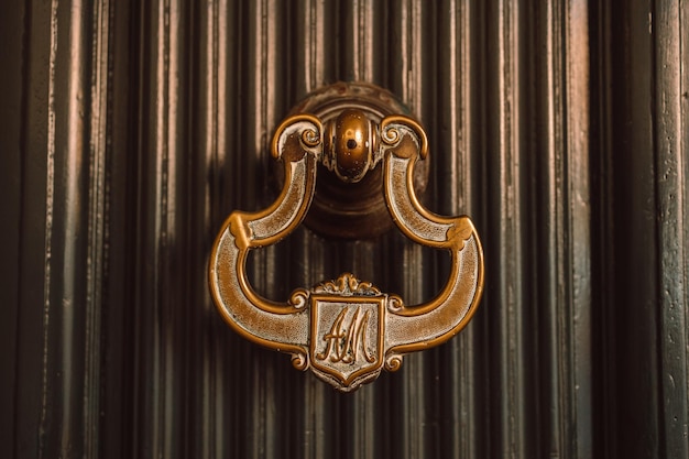 Luxurious wooden door with golden knocker high quality photo