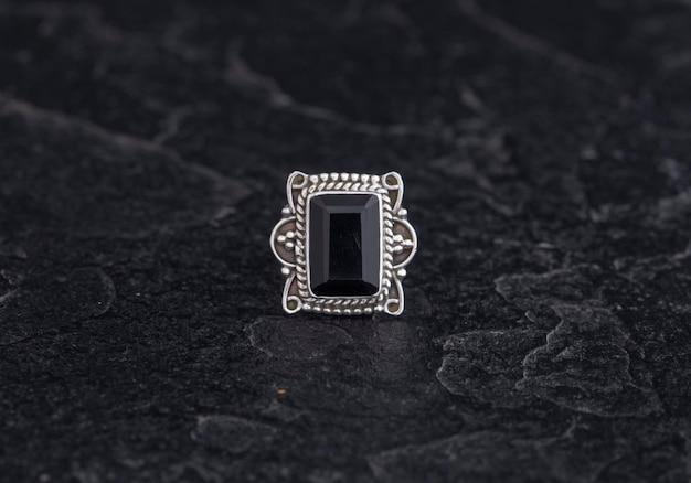 Luxury 925 Sterling Silver Ring on Vintage Black Background