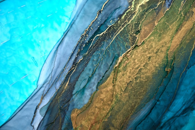 Luxury abstract background in alcohol ink technique, indigo blue gold liquid painting, scattered acrylic blobs and swirling stains, printed materials